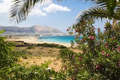 a view of a beach with the ocean at Kalami Rooms in Falasarna