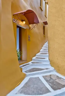 an alleyway with an arch in a building at Kores Boutique Houses in Chania Town