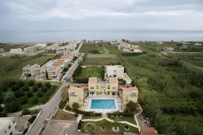 an aerial view of a house with a swimming pool at Daphnis Villas in Maleme