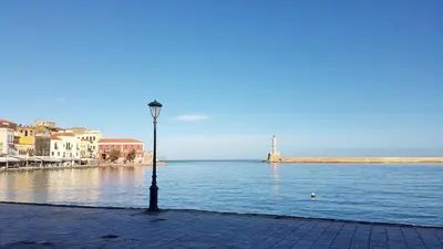 a street light next to a body of water at Aoria Estate Old Port in Chania Town