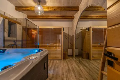 a large bathroom with a tub and a shower at Aspalathos Falassarna Villas in Falasarna