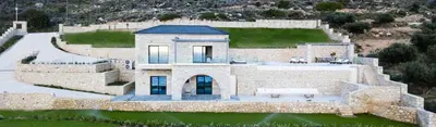 an aerial view of a large stone house at Aspalathos Falassarna Villas in Falasarna