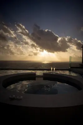 a view of a swimming pool with the ocean in the background at Aspalathos Falassarna Villas in Falasarna