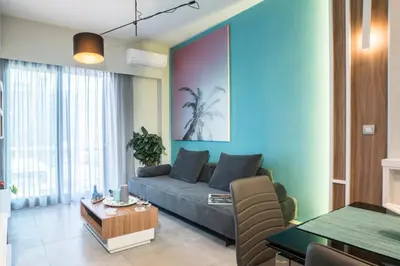 a living room with a couch and a table at Mediterranean Luxury Apartment in Chania Town