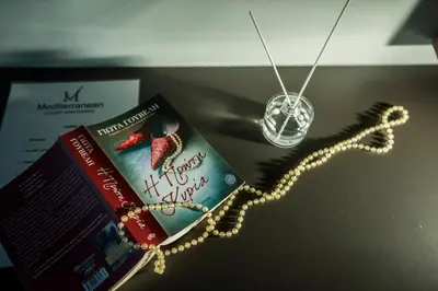 a book and a book chain next to a book at Mediterranean Luxury Apartment in Chania Town