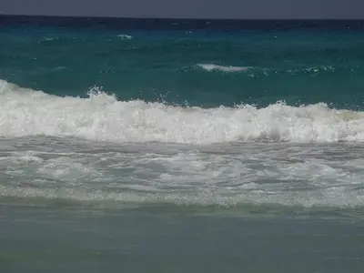 a group of waves in the ocean at Golden Sun Apartments in Falasarna