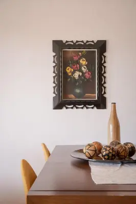 a table with a plate of food and a vase of flowers at Zen Serenity Retreat with Great Outdoors, Pool & Parking in Áptera