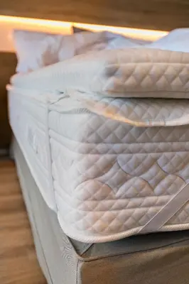 a close up of a white mattress on a bed at Oniros Residences in Souda