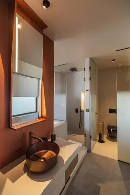 a bathroom with a bowl sink and a shower at Oniros Residences in Souda