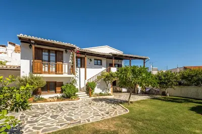 a house with a garden in front of it at Diktamo House in Agia Marina Nea Kydonias
