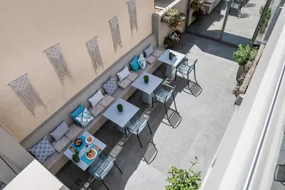 an overhead view of a restaurant with tables and chairs at Ciel Collection Suites in Chania Town