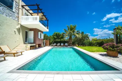 a swimming pool in the backyard of a house at Petronila Luxury Villa with heated private pool in Kissamos