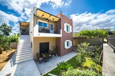 a view of a house with a patio at Petronila Luxury Villa with heated private pool in Kissamos