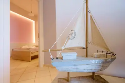 a wooden boat on display in a room at Gina's home in Kolymvari
