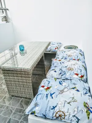 a room with two beds and a table at Zamboli in Chania Town