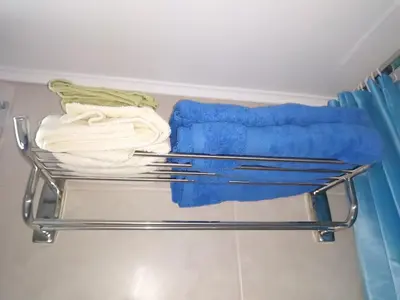 a towel rack with towels on it in a bathroom at Zamboli in Chania Town