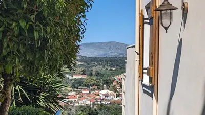 a view of a town from a window of a house at Villa Koumos - Crete Holidays With Pool and Views in Gavalochori