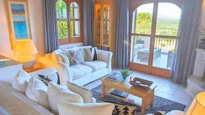 a living room with two couches and a table at Villa Koumos - Crete Holidays With Pool and Views in Gavalochori
