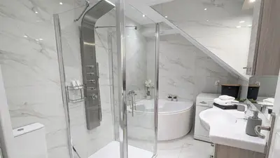 a bathroom with a shower and a sink at Villa Koumos - Crete Holidays With Pool and Views in Gavalochori