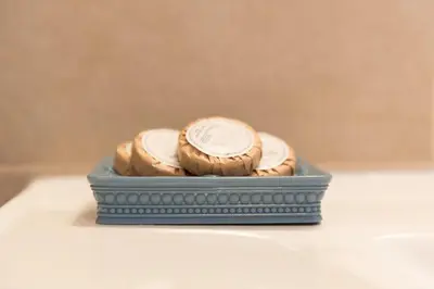 two cookies in a blue container on a table at Villa Katerina in Agia Marina Nea Kydonias