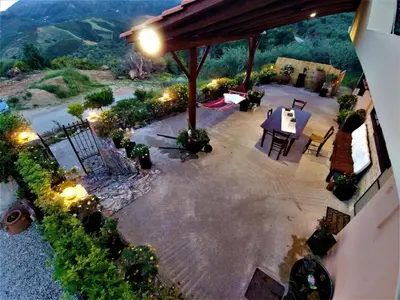 an overhead view of a patio with a table and chairs at Thymes traditional house in Loúlos
