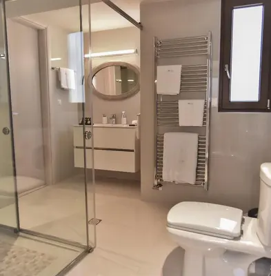 a bathroom with a shower and a toilet and a sink at Villa Evangelia in Chania Town
