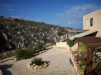 a building with a view of a mountain at Comfortable House near Chania in Kalathas