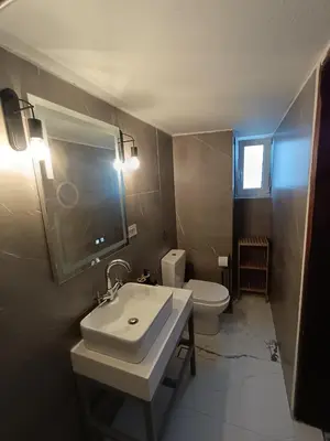 a bathroom with a sink and a toilet at PALACE Sea view in Megála Khoráfia