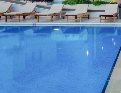 a swimming pool with lounge chairs and a swimming pool at Aspasias Luxury Suite in Chania Town