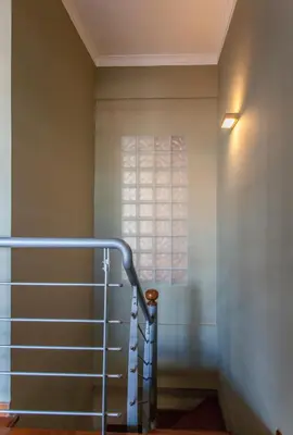 a staircase in a room with a window at Sea view maisonette in Chania Town
