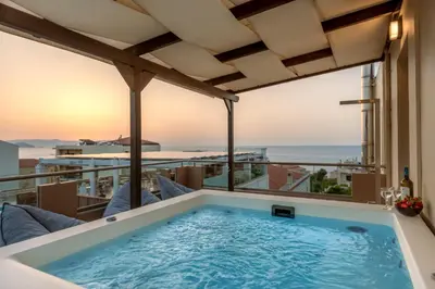 a hot tub on the balcony of a hotel at Soleado apartment in Chania Town
