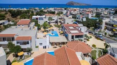 an aerial view of a city with a resort at Toxo Hotel in Plataniás