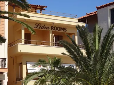 a building with a sign that reads eliza rooms at Lidra Rooms in Chania Town