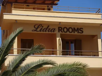 a sign on the side of a building at Lidra Rooms in Chania Town