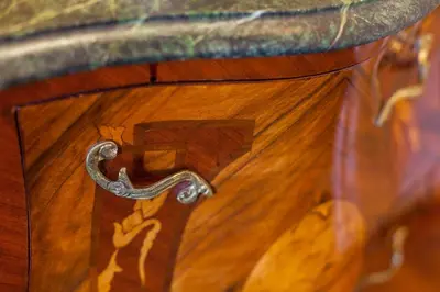 a close up of a letter f on a wooden table at Casa Leone Hotel in Chania Town