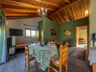 a dining room with a table and chairs at Kavros House in Arménoi