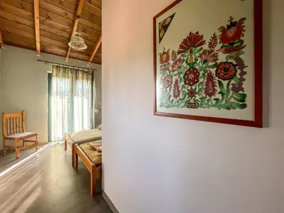 a living room with a painting on the wall at Kavros House in Arménoi