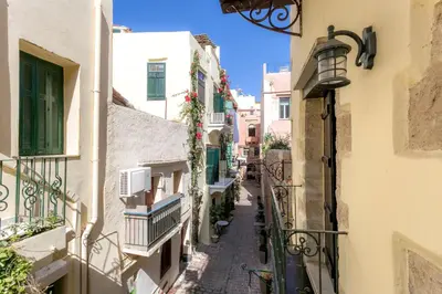 an alley in an old town with buildings at Ifigenia Traditional Rooms & Maisonettes in Chania Town