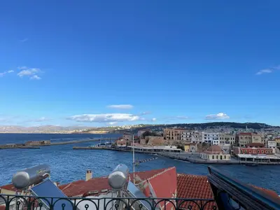 a view of a harbor from a balcony at Ifigenia by Captain Michalis in Chania Town