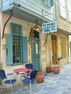 a table and chairs in front of a building at Pension Lena in Chania Town