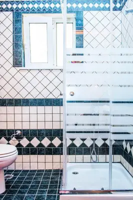 a bathroom with a shower and a toilet at Marelen Apartment Near Chania Center in Chania Town