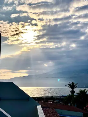 a view of the ocean with a cloudy sky at Flisvos Rooms in Frangokastello