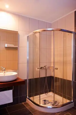 a bathroom with a shower and a sink at Elena Beach Hotel in Kissamos