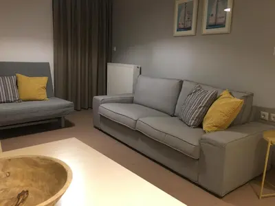 a living room with a couch and a table at Kleanthi Studios in Chania Town