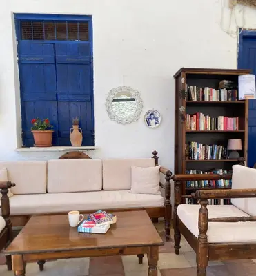 a living room with a couch and a coffee table at Sifis in Loutro