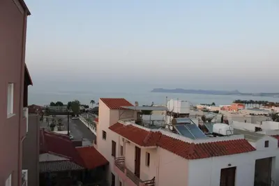 an aerial view of a city with a body of water at Mithos Premium Rooms in Agia Marina Nea Kydonias