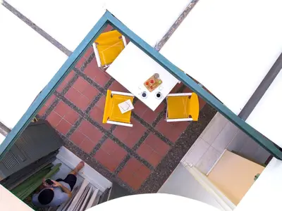 an overhead view of a man standing in front of a building at Villa Pefki in Chania Town