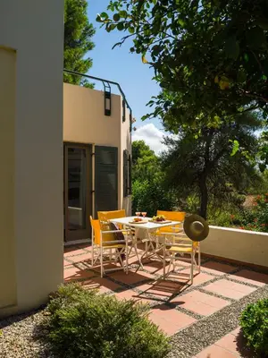 a table and chairs sitting on a patio at Villa Pefki in Chania Town