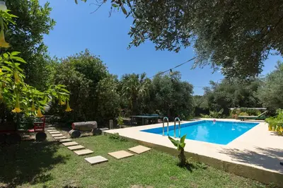 a pool in the backyard of a house at Sofiana's Garden Retreat with Private Pool in Drapaniás
