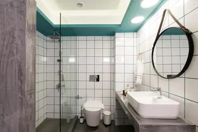 a bathroom with a sink and a toilet at NK Apartments in Falasarna